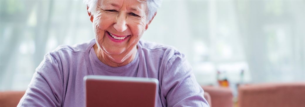 Senior woman looking at ipad
